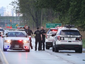 Windsor Police officers are shown during an investigation on May 19, 2018 on Ojibway Parkway that caused the closure of the eastbound lanes between Weaver and Broadway for several hours.