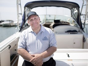Mark Lesperance, owner of Perpetual Waters Charter Service, is shown next to his 31-foot Sea Ray Amberjack at the Leamington Marina, Thursday, May 17, 2018.