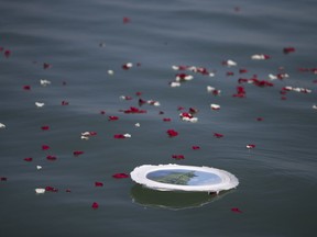 A biodegradable urn floats on the surface of Lake Erie off of Leamington Marina, Thursday, May 17, 2018.  Perpetual Waters Charter Service offers funeral services on board a 31-foot boat.