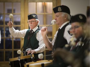 Members of the Scottish Society of Windsor Pipe Band and the Windsor Police Pipe Band collaborate Saturday to perform Amazing Grace as part of a worldwide tribute to the victims of last year's bombing at the Ariana Grande concert in Manchester, England.