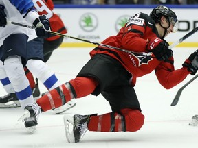 Finland's Miro Heiskanen, left, checks Canada's Ryan Nugent-Hopkins, right, during the Ice Hockey World Championships group B match between Canada and Finland at the Jyske Bank Boxen arena in Herning, Denmark, Saturday, May 12, 2018.