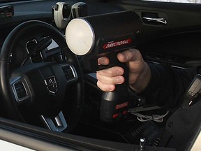 A Windsor police officer wields a radar gun in this 2015 file photo.