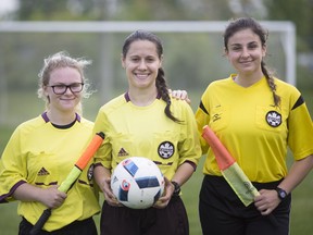 From left, assistant referee Bridgette Gignac, referee Teodora Glisic and assistant referee, Tina Selwan, referee the W.E.C.S.S.A.A girls 'AA' soccer final at McHugh Park, Tuesday, May 22, 2018.