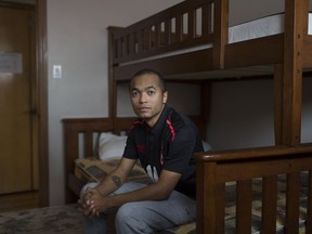 Giovanny Cortes Reyes, who came from Colombia as a refugee, is shown April 18, 2018, in the room his family stayed in at Matthew House, an emergency shelter and welcome centre for newly arrived refugee claimants.