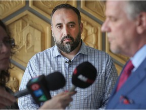 Windsor Ward 3 Coun. Rino Bortolin looks on as his lawyer David McNevin speaks with media at City Hall on May 4, 2018.