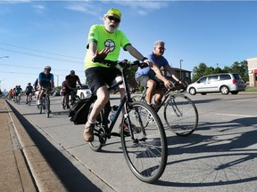 Cyclists with the Slow Ride Windsor group are shown on Howard Avenue on Wednesday, May 23, 2018 at the start of their 90-minute group ride.