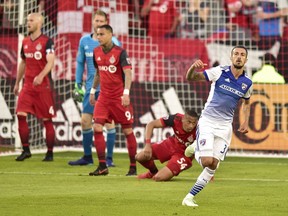 FC Dallas forward Maximiliano Urruti celebrates his goal against the Toronto FC during first half MLS soccer action in Toronto on May 25, 2018.