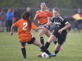 WINDSOR, ONT:. MAY 18, 2018 -- Tecumseh Vista's Tia-Lynne McCann attempts to get around Sandwich's Katie Fettes in the W.E.C.S.S.A.A girls 'AA' soccer final between Sandwich Secondary School and Tecumseh Vista Academy at McHugh Park, Tuesday, May 22, 2018.