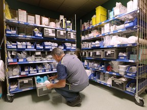An employee works in a medical supply area at a Windsor hospital on Friday, May 11, 2018.