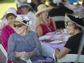 Shirley Hitchcock, left, and Annette Palmer, both from Amherstburg, are joined by friends at the Downton Abbey-themed first annual Rhododendron Garden Tea Party in the Kings Navy Yard Park, Amherstburg, on Sunday, May 27, 2018.