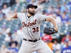Detroit Tigers starting pitcher Michael Fulmer (32) throws during the first inning of a baseball game against the Texas Rangers, Monday, May 7, 2018, in Arlington, Texas.