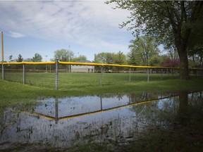 Puddles of water are shown next to a baseball field at Mic Mac Park, Tuesday, May 15, 2018.