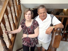 Donna and Jack Desmarais of LaSalle were twice victimized by flooding events causing stress in what Donna describes as "the most scariest experience in their lives."  In photo, Jack and Donna Desmarais pose on a stairway leading to their third and fourth levels June 11, 2018.