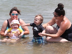It's beach time! Aunt Heather Caron, left, with twins Frankie Nardone and Oliver Nardone, 11 months old, and their mother, Jodie Nardone enjoy a green flag day at  Sand Point Beach on June 13, 2018.
