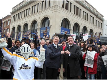 University of Windsor President Alan Wildeman accepts keys to The Windsor Star's Ferry Street building from Windsor Star Publisher and Editor in Chief Marty Beneteau, right, during a change of ownership celebration on Nov. 30, 2012.