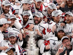 Alex Ovechkin of the Washington Capitals poses with his teammates for the team photo after their 4-3 win over the Vegas Golden Knights to win the Stanley Cup in Game Five of the 2018 NHL Stanley Cup Final at T-Mobile Arena on June 7, 2018 in Las Vegas, Nevada.