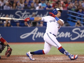 Yangervis Solarte #26 of the Toronto Blue Jays hits a two-run home run in the seventh inning during MLB game action against the Washington Nationals at Rogers Centre on June 15, 2018 in Toronto.