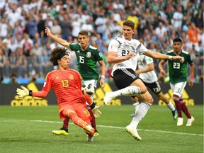 Guillermo Ochoa of Mexico makes a save from a shot by Mario Gomez of Germany during the 2018 FIFA World Cup Russia group F match between Germany and Mexico at Luzhniki Stadium on June 17, 2018 in Moscow, Russia.
