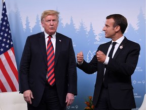 US President Donald Trump and French President Emmanuel Macron hold a meeting on the sidelines of the G7 Summit in La Malbaie, Quebec, June 8, 2018. Analysts say the markets are behaving cautiously pending more clarity from G7 leaders on trade issues.