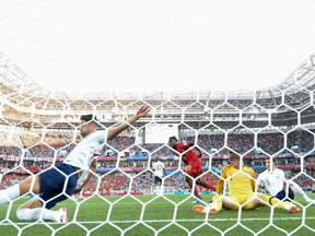 England's defender Gary Cahill (L) kicks the ball under the goal's crossbar during the Russia 2018 World Cup Group G football match between England and Belgium at the Kaliningrad Stadium in Kaliningrad on June 28, 2018. (AFP/Getty Images)