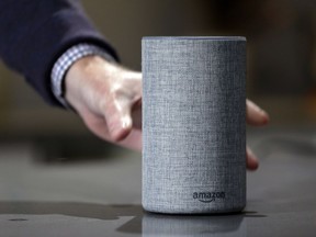FILE - In this Sept. 27, 2017, file photo, a new Amazon Echo is displayed during a program announcing several new Amazon products by the company, in Seattle. Amazon has launched a version of Alexa for hotels that lets guests order room service through the voice assistant, ask for more towels or get restaurant recommendations without having to pick up the phone and call the front desk. Marriott signed up for the service.