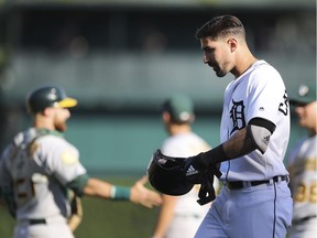 Detroit Tigers right fielder Nicholas Castellanos walks to the dugout after grounding out to end the baseball game against the Oakland Athletics, Monday, June 25, 2018, in Detroit. Oakland won 5-4.