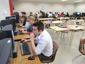 Brennan High School students  work on computers during class in this file photo.