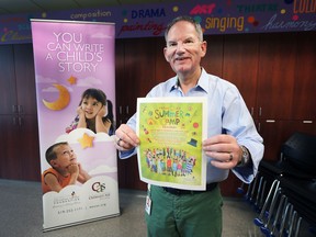 The Windsor-Essex Children's Aid Foundation is short about $30,000 of its $50,000 fundraising goal to send 350 kids to camp this summer. Mike Clark, Manager of Public Relations and  Fund Development holds up a camp brochure on Tuesday, June 26, 2018.