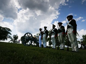 Standing on guard during last year's July 1 celebrations at Fort Malden National Historic Site in Amherstburg were Royal Regiment of Artillery re-enactors, from left, Eric Wilson Owen Herold, Matt Nelson, Carly LeBlanc and Mike Gerard