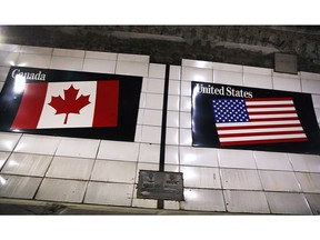 The Canadian/United States border line in the Detroit/Windsor tunnel is shown on June 13, 2018.