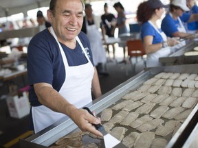 Costa Flodoia barbecues gyro meat at the Greek Village on June 17, 2018, during Windsor's Carrousel of the Nations.