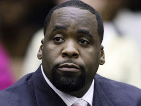 FILE - In this May 25, 2010 file photo, former Detroit Mayor Kwame Kilpatrick sits in a Detroit courtroom. Kilpatrick has been moved from a federal prison in Oklahoma to a federal detention center in Philadelphia. The 47-year-old Kilpatrick was transferred Monday June 5, 2018. Kilpatrick was sentenced in 2013 to 28 years in prison for extortion, bribery, conspiracy and other crimes during his years in office. He had been housed at the Federal Correction Institute at El Reno, west of Oklahoma City. Kilpatrick's release date is Aug. 1, 2037.