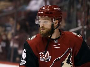 In this March 5, 2017, photo, Arizona Coyotes' Max Domi looks on before an NHL hockey game against the Carolina Hurricanes in Glendale, Ariz. Montreal Canadiens have signed Domi to a two-year deal.