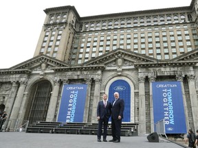 Ford Motor Co., Executive Chairman Bill Ford, left, and CEO James Hackett pose outside the Michigan Central train depot, Tuesday, June 19, 2018, in Detroit. Ford Motor Co. is embarking on a 4-year renovation of the 105-year-old depot and 17-story office tower just west of downtown. The massive project is expected to increase the automaker's footprint in the city where the company was founded, provide space for electric and autonomous vehicle testing and research, and spur investment in the surrounding neighborhood.