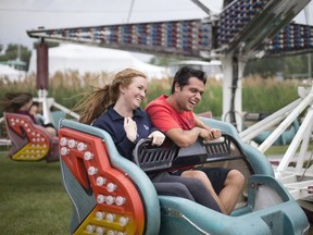LASALLE, ONT:. JUNE 9, 2018 -- Taylor Shanahan, left, and Nick Raffoul ride the Sizzler at the LaSalle Strawberry Festival, Saturday, June 9, 2018.
