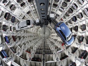 FILE - In this April 28, 2016 file photo Volkswagen cars are presented to media inside a delivery tower in Wolfsburg, Germany.