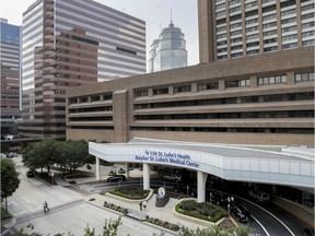 This June 1, 2018, photo shows Baylor St. Luke's Medical Center in Houston. Baylor St. Luke's Medical Center has suspended all medical procedures in its renowned heart transplant program following the deaths this year of at least three patients.