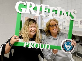 Melissa Maddox, vice-principal of W.F. Herman Academy , left, and alumnus Lana Horvath frame themselves with school spirit at the school during an open house on June 2, 2018.  Both women are on the alumni committee that organized school tours for Herman's 60th anniversary.