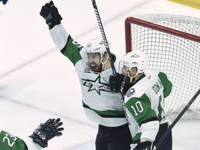 Texas Stars left wing Curtis McKenzie (16) celebrates his goal with teammate Justin Dowling (10) during second period AHL Calder Cup playoff action against the Toronto Marlies in Toronto on June 12, 2018. Texas forces a Game 7.