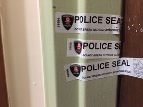 Windsor Police tape seals door of an apartment at 1382 University St. West. in Windsor on June 12, 2018.