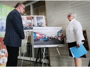 Windsor Mayor Drew Dilkens and Kitty Pope, chief executive officer Windsor Public Library are shown during a press conference on Monday, June 25, 2018, announcing the temporary location for the central library branch.