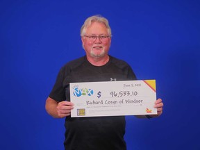 Richard Cosyn of Windsor holds his prize cheque from the Lotto MAX draw of June 1, 2018.