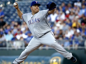 Texas Rangers starting pitcher Bartolo Colon throws during the first inning of a baseball game against the Kansas City Royals Monday, June 18, 2018, in Kansas City, Mo.