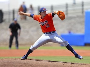 Auburn pitcher Casey Mize throws against Florida during the first inning of an NCAA Super Regional college baseball game Saturday, June 9, 2018, in Gainesville, Fla.