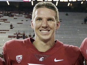 In this Sept. 9, 2017, file photo, Washington State quarterback Tyler Hilinski poses for a photo after an NCAA college football game against Boise State in Pullman, Wash.