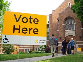 People line up to vote on June 7, 2018.