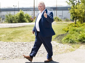 Ontario premier-designate Doug Ford leaves after announcing his commitment to keeping the Pickering Nuclear Generating Station in operation until 2024 in Pickering, Ont., on Thursday, June 21, 2018.