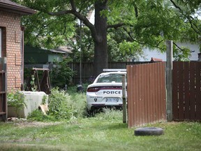 A Windsor police cruiser sits in the yard of a residence at 1640 Arthur Rd. on June 1, 2018.
