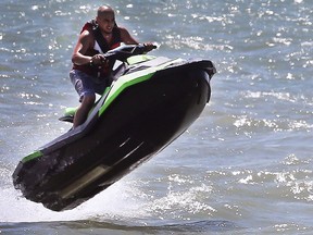 Stay hydrated in this weekend's heat. In this June 11, 2018, file photo, a jet ski rider takes advantage of the warmth and sunshine and catches air on the Detroit River.