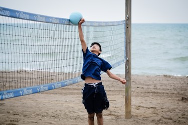 A volleyball player tries to play the ball over the net at Colchester Beach. The Town of Essex promotes healthy, active living for its residents.
